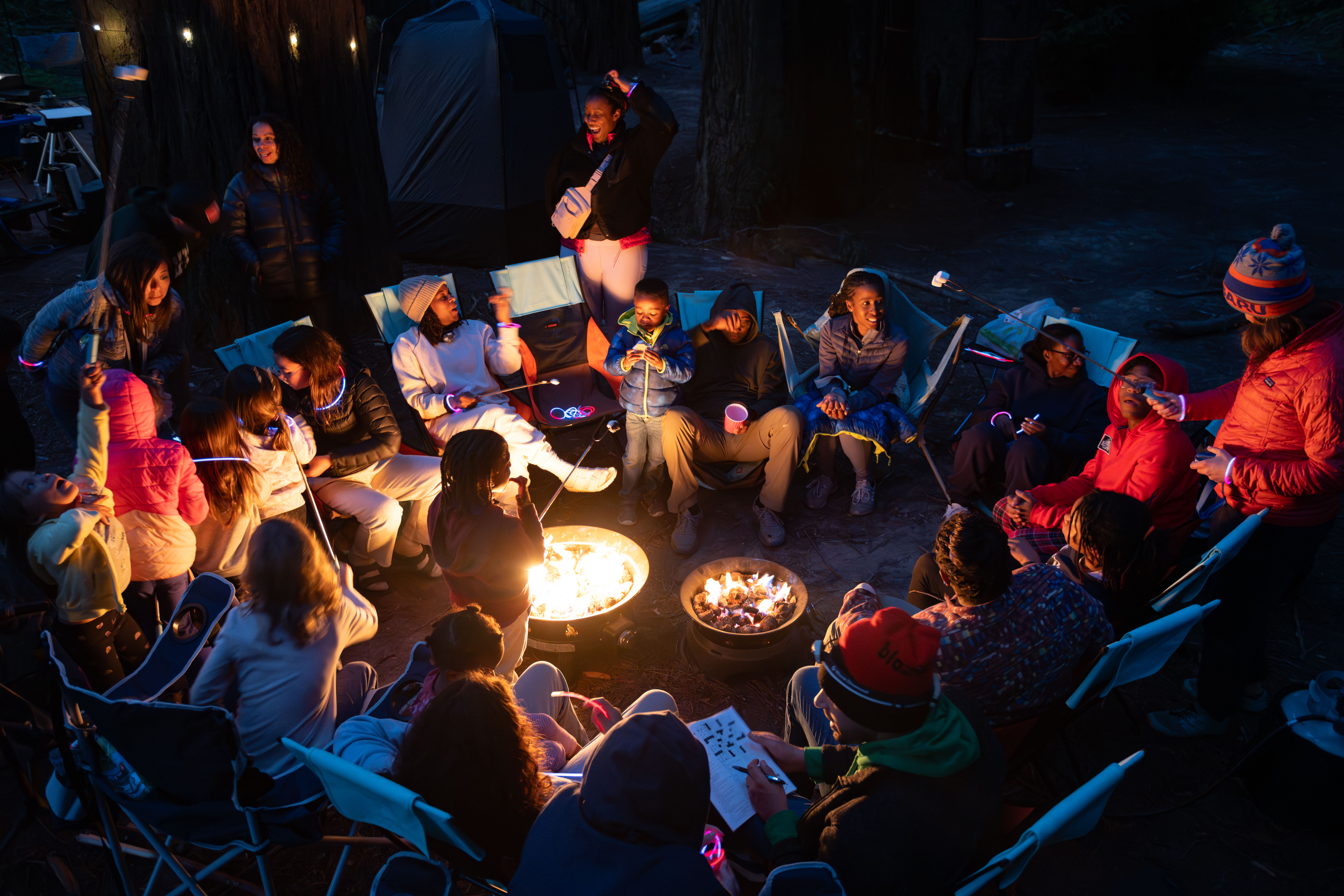 Community gathered around campfire